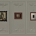 Decorative Wall Panel With Ornate Moldings And Three Framed Artworks Hanging