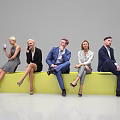 Group of Business People Sitting on Yellow Bench with Coffee Cups and Mobile Phones