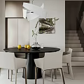 Modern Dining Room with Black Round Table White Chairs Vase Green Plants and Lemons