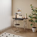 Modern Desk with Curved Metal Legs Dark Tabletop Lamp Photo Frame Vase and Green Plant