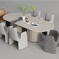 Round Dining Table Set With Various Style Chairs Green Plant And Books