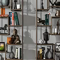 Modern Metal Shelving Unit With Decorative Books Sculptures Vases And Photo Frames