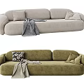 Plush Three-Seater Sofa in Light Gray and Green with Cozy Cushions and Throw Blanket