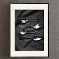 Silver Spoons Placed On Textured Cloth In Monochrome Setting 3d model