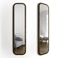 Wooden Framed Full Length Mirror Reflecting Gray Chair Ottoman White Walls And Wooden Floor
