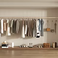 Various Clothes Hanging On Rail In Wardrobe Area With Bags Shoes Bookshelf And Boxes