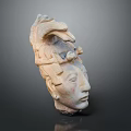 Man Head Sculpture Featuring Intricate Bird Ornament and Artistic Carved Details