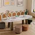 Oval Marble Top Entertainment Table With Colorful Stools Clear Chair Flower Vase And Wall Art