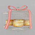 Assorted Cookies And Pastries On Glass Pedestal Trays With Pink Bow Decoration