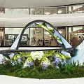 Modern Indoor Floral Installation In Mall Atrium With Curved Arch Colorful Flowers And Lush Greenery