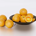 Fresh Ripe Oranges Arranged in Black Plate with Sliced and Whole Pieces on Light Surface