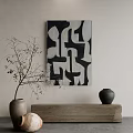 Abstract Black And White Wall Art With Twig Decoration And Ceramic Vases On Wooden Tabletop