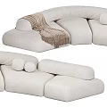 Modern Beige Sectional Sofa With Curved Design Soft Pillows And Throw Blanket
