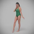 Woman In Green One Piece Swimsuit Standing Against White Background Full Length View