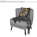 Gray Accent Chair With Gold Legs Colorful Pillow And Gray Throw Blanket Tassels