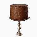 Three Beautiful Cakes With Unique Textured Frostings On Silver Stands