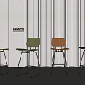 Flexform Modern Bar Stools With Green And Orange Seats Metal Frame Gray Wall Background