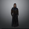 Stylish Woman In Long Dark Coat With Brown And Blue Panels And Pockets Standing