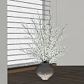 White Flowers in Gray Vase with Window Blinds Light Wall and Wooden Floor