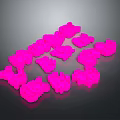 Vibrant Pink Irregular Shaped Objects Arranged On Dark Background Surface