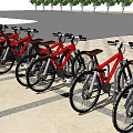 Red Bicycles Parked In Order On Paved Outdoor Area With Trees Background