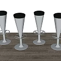 Modern Silver Metal Bar Stools With Black Padded Seats And Round Base Set Of Four