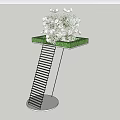 Banquet Hall Decor With White Metal Stand Circular Tray White Flowers And Green Grass