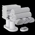 Gray Towels Stacked And Rolled With Soap Dispenser Tumbler And Soap Dish In Bathroom Setup