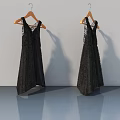 Black Lace Dresses Hanging On Hangers Against White Wall And Gray Floor