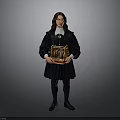 A man in black robe with white collar holding golden intricate object against gray background