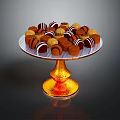 Assorted Chocolate Candies on Golden Pedestal Stand with Striped and Round Toppings