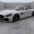 White Mercedes AMG Convertible Sports Car With Sleek Aerodynamic Design And Black Alloy Wheels