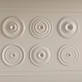White Wall Decor with Circular Relief Patterns Arranged in Rows and Decorative Borders 3d model