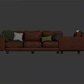 Red Sofa And Armchair With Colorful Cushions And Patterned Blankets
