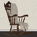 Classic Wooden Rocking Chair With Carved Back And Fringed Blanket In Minimalist Room