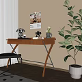 Wooden Desk Setup in Room Corner with Metallic Lamp Vase and Green Plant