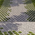 Outdoor Patio Pathway With Geometric Pattern Floor Tiles And Grass Surroundings