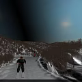 Stunning Snow Covered Alpine Mountain Scenery With Two Skiers Skiing On Wide Smooth Winter Slope