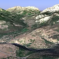 Rugged Mountain Valley Landscape With Flowing River And Green Brown Slopes