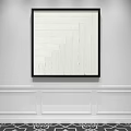 Black Framed White Abstract Painting On Minimalist White Wall With Wainscoting