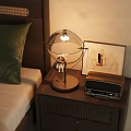 Wooden Bedside Table With Transparent Globe Lamp Vintage Radio And Abstract Painting Frame
