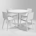 Modern Round Wooden Table With White Legs And Four Colored Upholstered Chairs