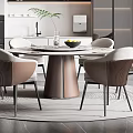Modern Restaurant Interior Featuring Round Dining Table Hanging Lamp And Comfortable Chairs