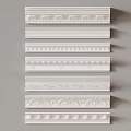 White Decorative Moldings With Various Patterns In Vertical Arrangement On Grey Background 3d model