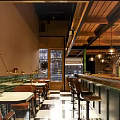 Stylish Bar Interior Design With Wooden Ceiling Pendant Lights Bar Counter And Tables