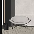 Modern Gray Accent Chair with Curved Backrest Metal Legs and Side Table in Minimalist Room