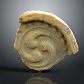 Intricate Spiral Stone Sculpture With Circular Carved Patterns And Textured Surface