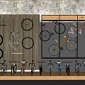 Various Bicycles Displayed on Wall Mounts and Shelves with Wheel Accents