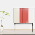 Modern Sideboard With Wooden Red And White Panels Black Legs And Potted Plant