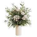 Elegant White Flower Arrangement in White Vase with Fresh Green Leaves